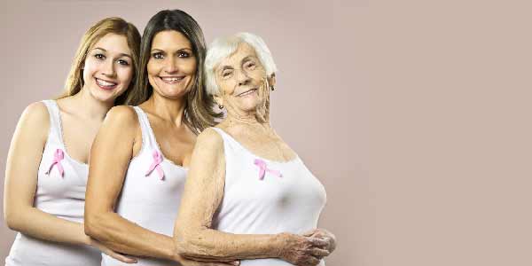 3 woman wearing the pink ribbon for breast cancer day